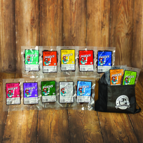 picture of assorted flavors of jerky with the black adventure bag