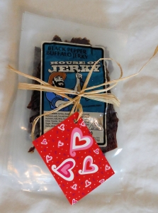 Bags of Jerky tied in ribbon with a valentine gift note