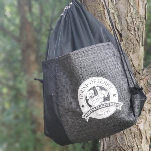house of jerky adventure back pack hanging on a tree