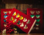 Red macaroon box with 1oz bags of beef jerky inside