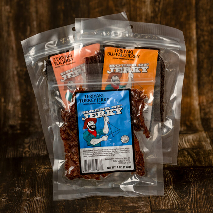 three bags of teriyaki flavored meat: turkey, elk and buffalo